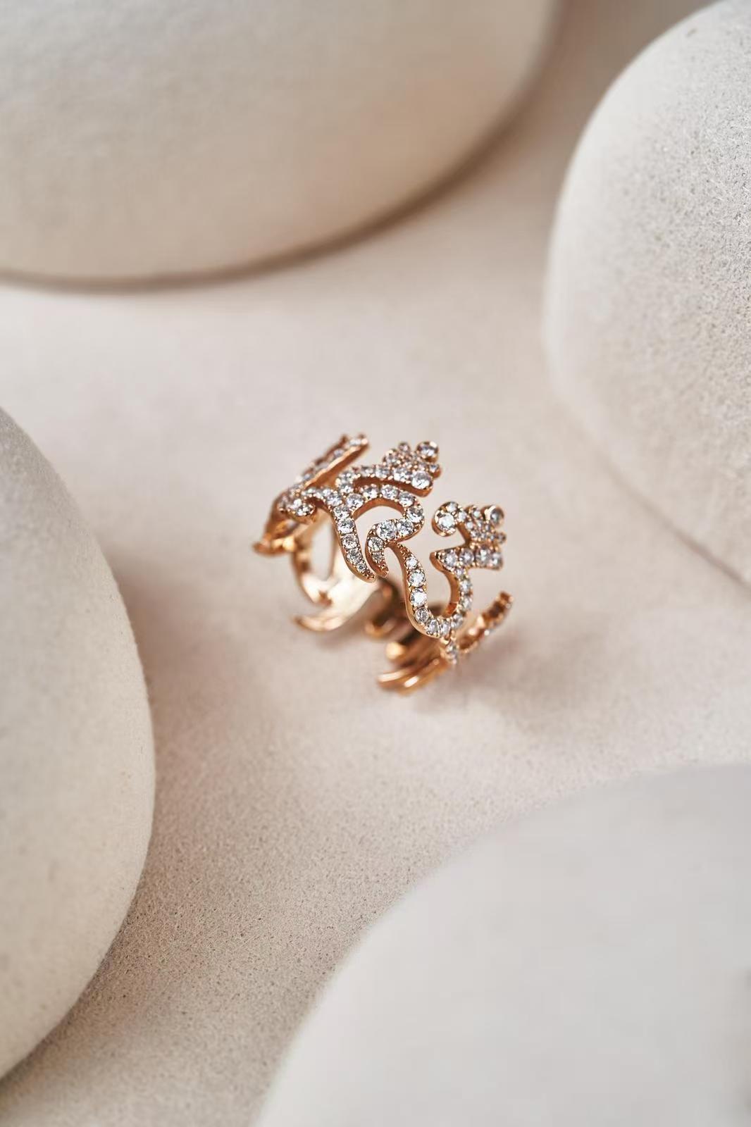 The six -Character Great Bright  Mantra" (Om Mani Padme Hum) diamond ring